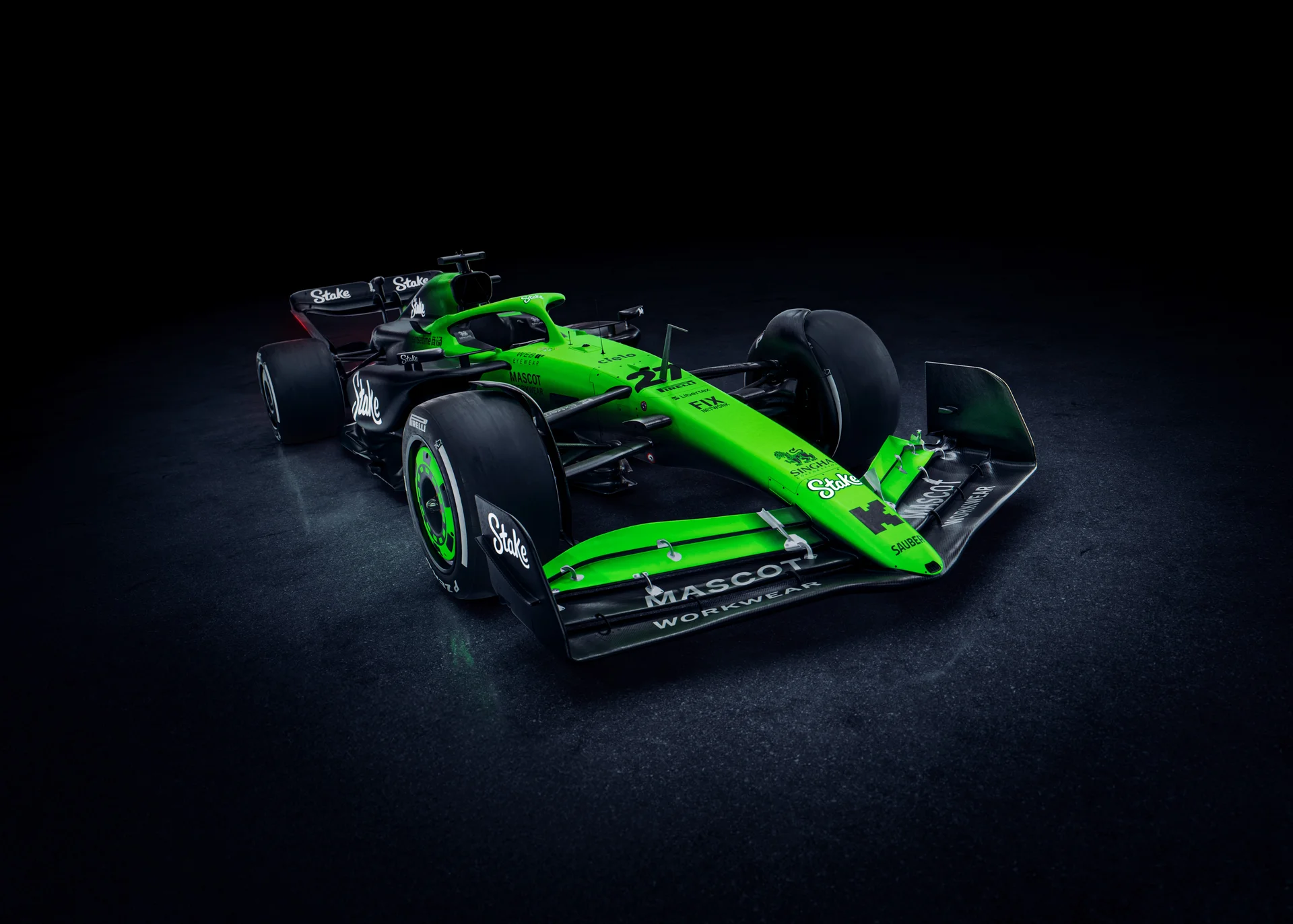 Close-up detail view of the Sauber C45 Formula 1 car, highlighting the aerodynamic design and livery in a high-contrast lighting setup.