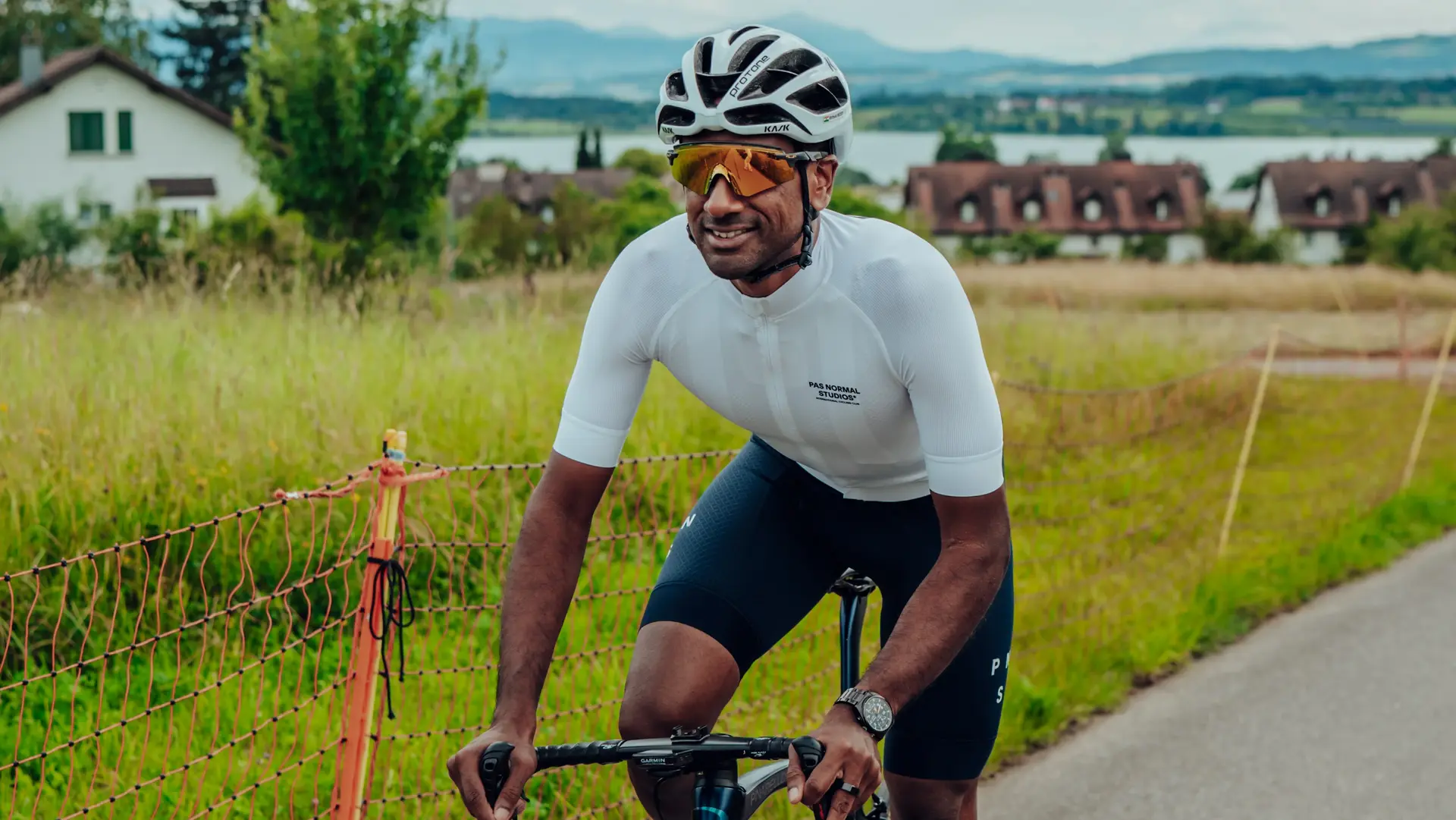 Group of Sauber Motorsport employees and cycling enthusiasts gathered for an industrial building for an afterwork cycling event.