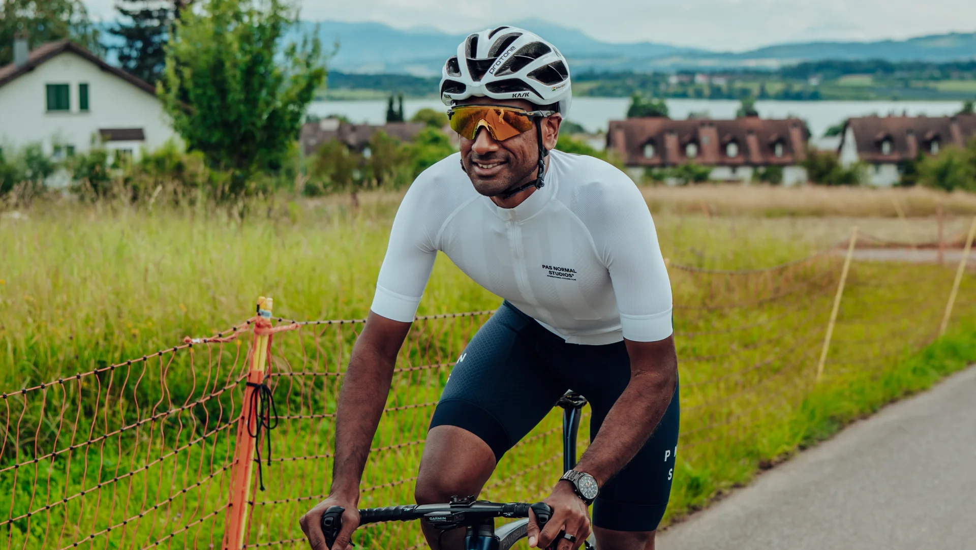 Group of Sauber Motorsport employees and cycling enthusiasts gathered for an industrial building for an afterwork cycling event.