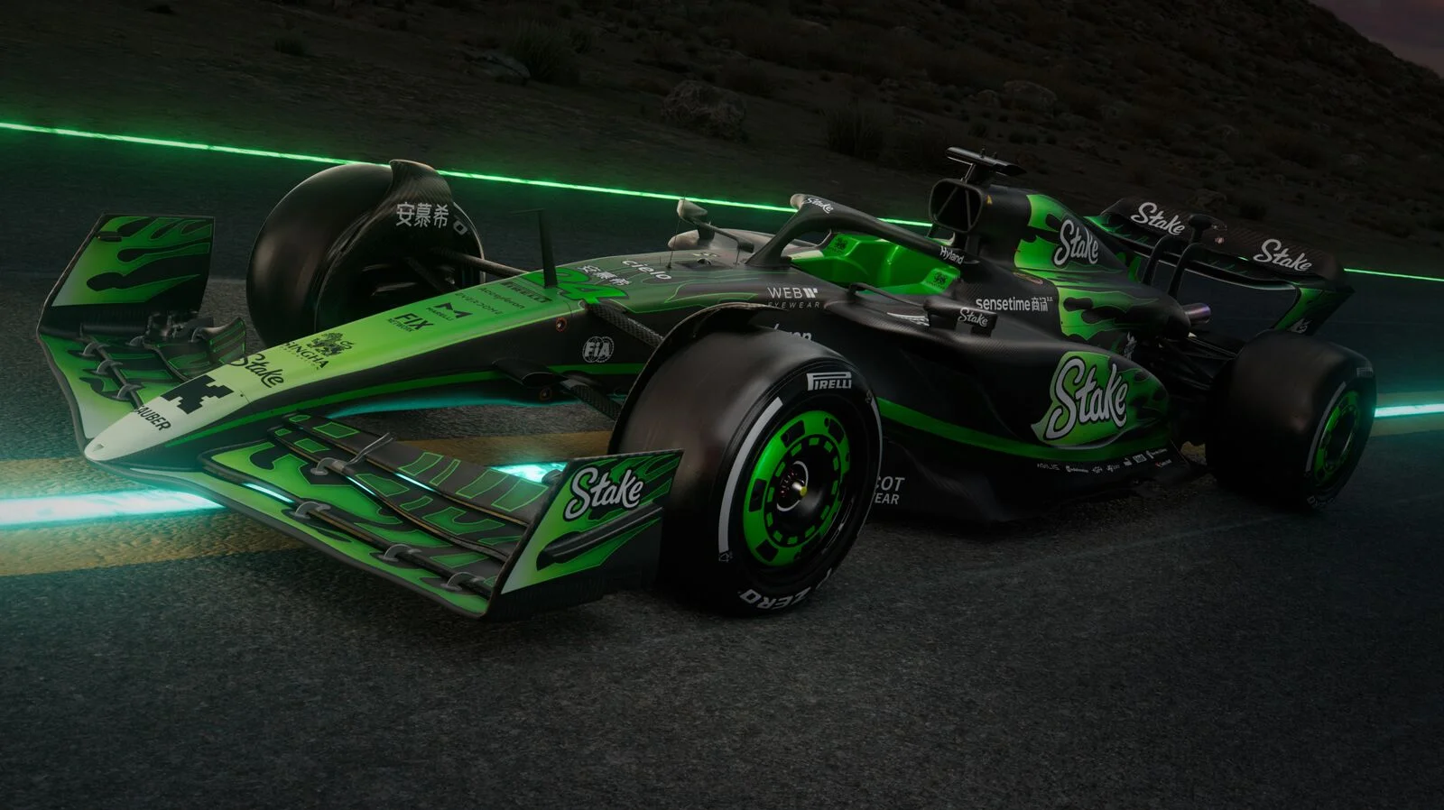 A front-left dynamic view of the C44 Formula 1 car featuring Stake sponsorship, illuminated in green lighting, showcasing aerodynamic design and performance details.