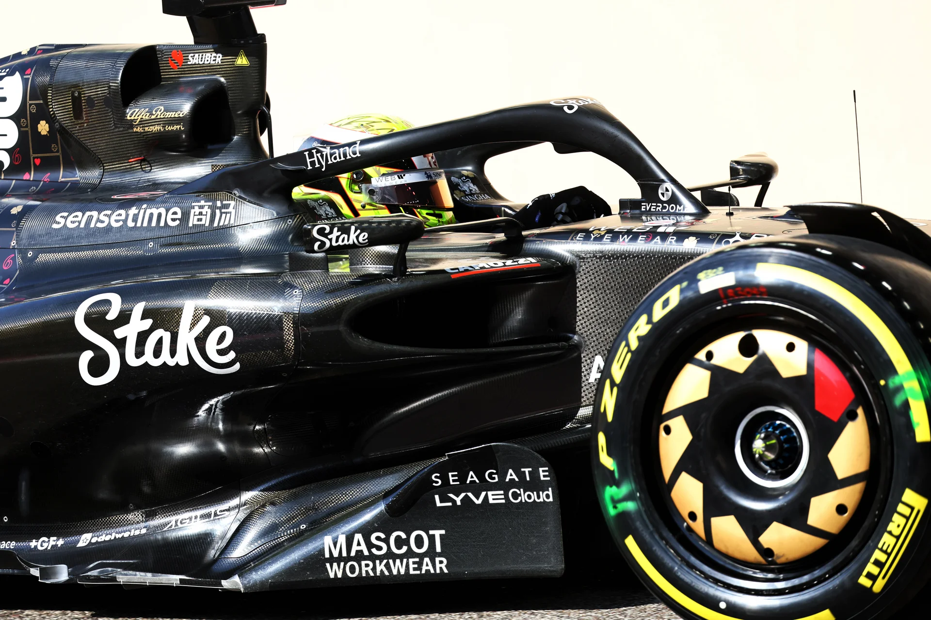 Close-up of a black Formula 1 car from the Sauber team during the 2023 post-season test, featuring intricate aerodynamic details and sponsor logos.