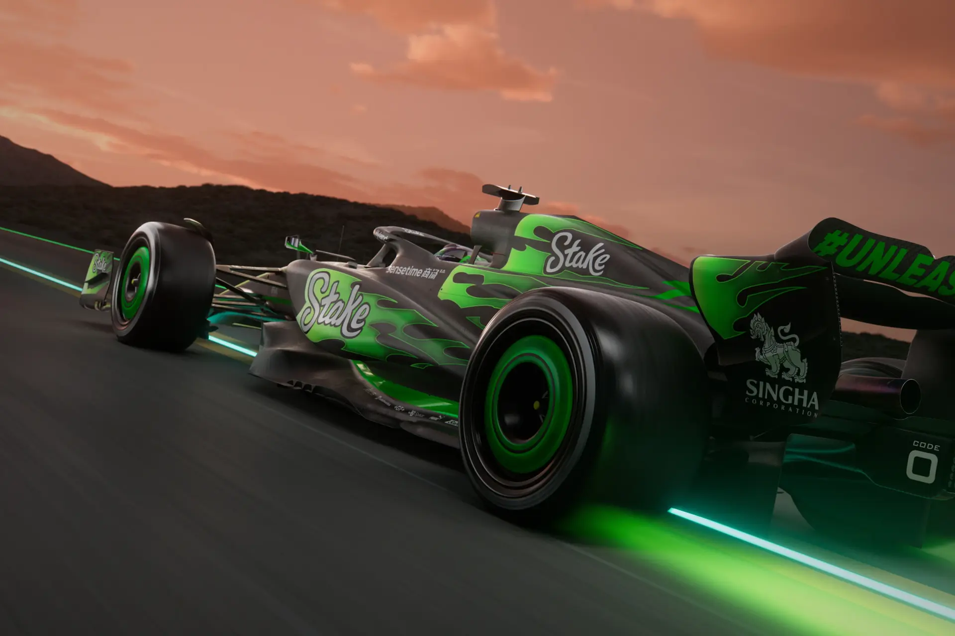 A high-resolution image (4000x3000) of the C44 Formula 1 car, showcasing its rear left view with a dynamic fire trail effect and Stake branding during a twilight race scene.