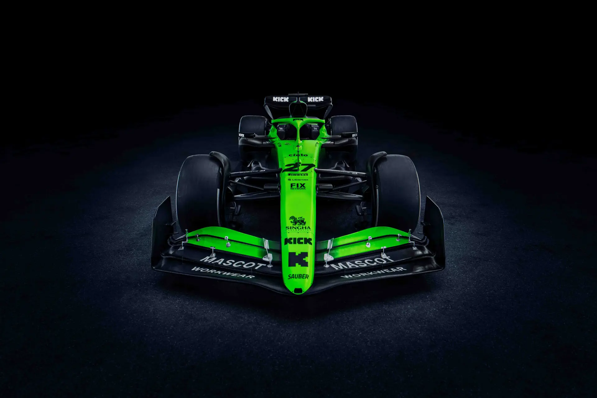 Front view of the Sauber C45 Formula 1 car, showcasing its aerodynamic nose, front wing, and sponsor branding under dramatic lighting.