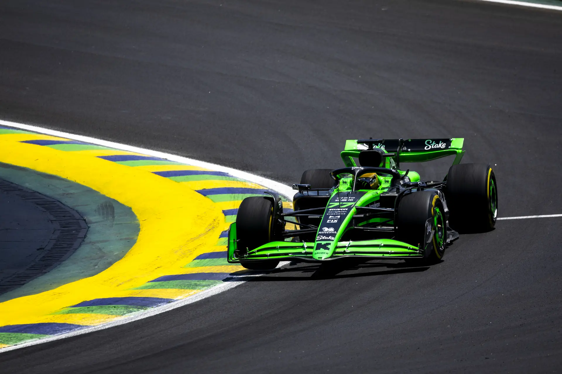 Sauber Formula 1 car speeding through a corner at the 2024 Brazilian Grand Prix during Friday's practice session, showcasing the team's latest performance updates on the Interlagos circuit.