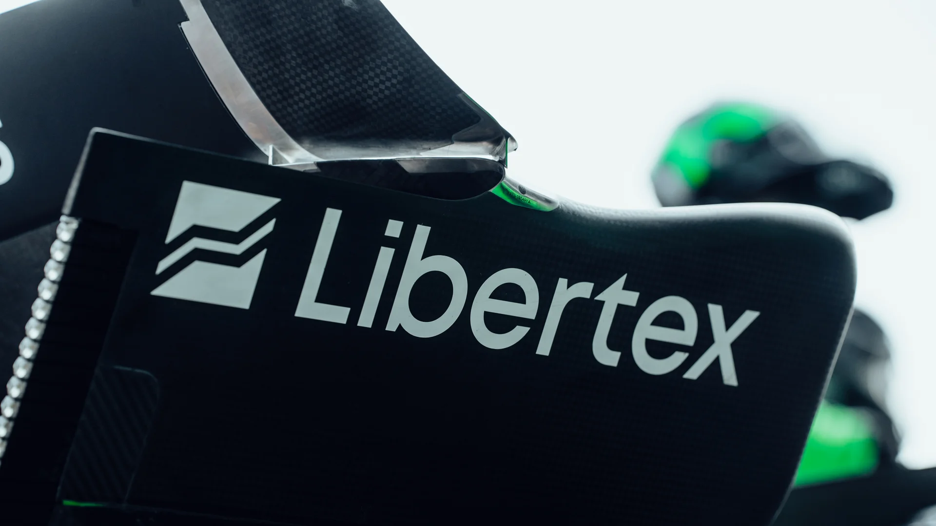 Close-up of the Sauber F1 car’s rear wing displaying sponsor logos during the Barcelona test day, highlighting team partnerships and branding.
