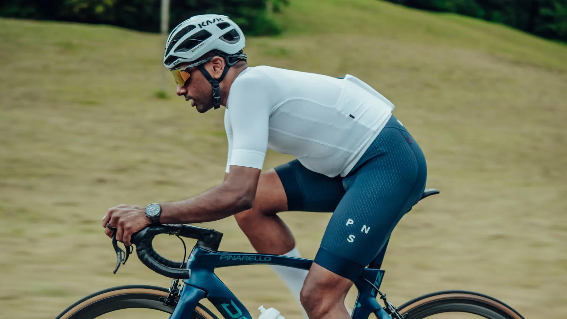Group of Sauber Motorsport employees and cycling enthusiasts gathered for an industrial building for an afterwork cycling event.
