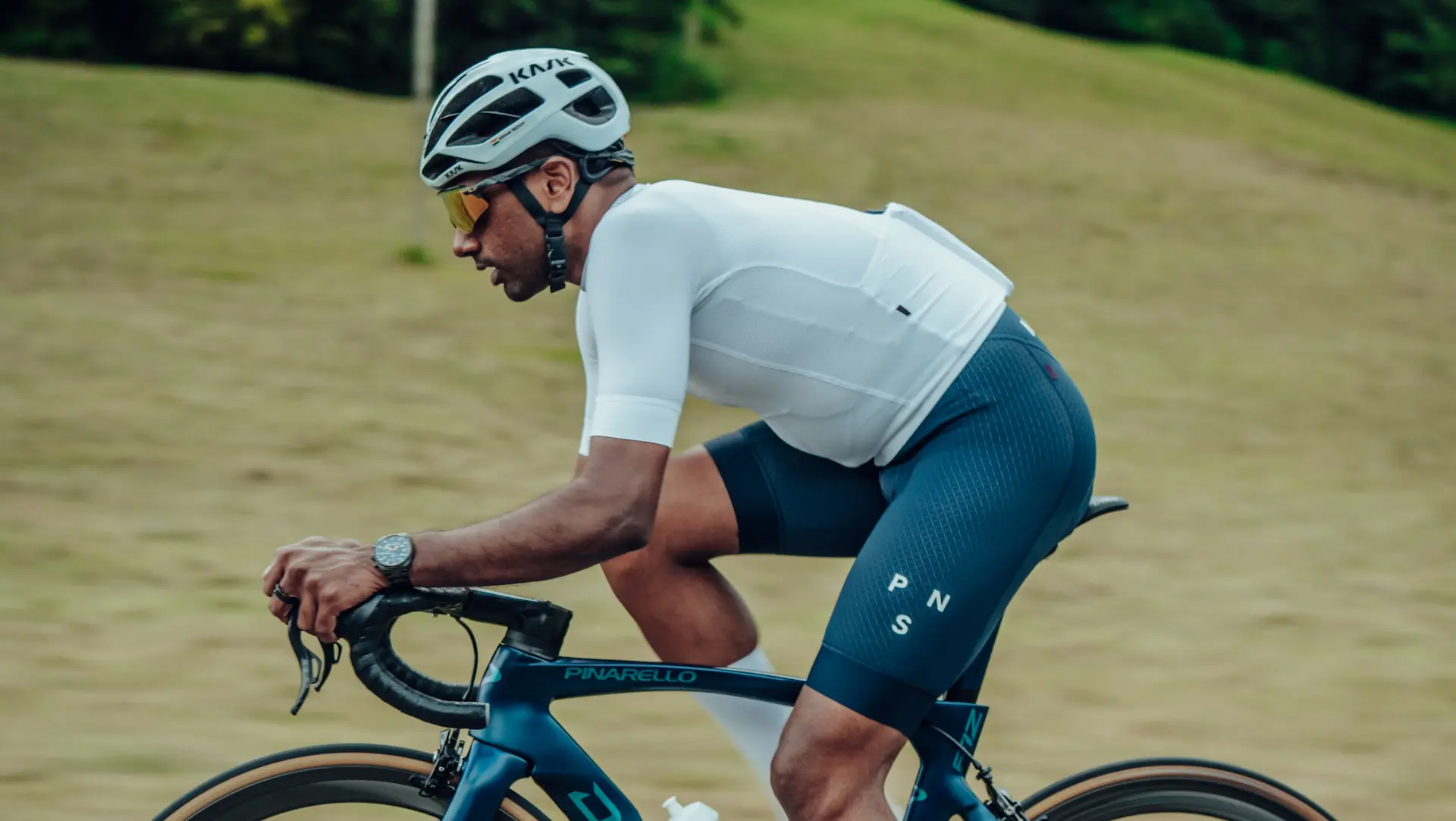 Group of Sauber Motorsport employees and cycling enthusiasts gathered for an industrial building for an afterwork cycling event.