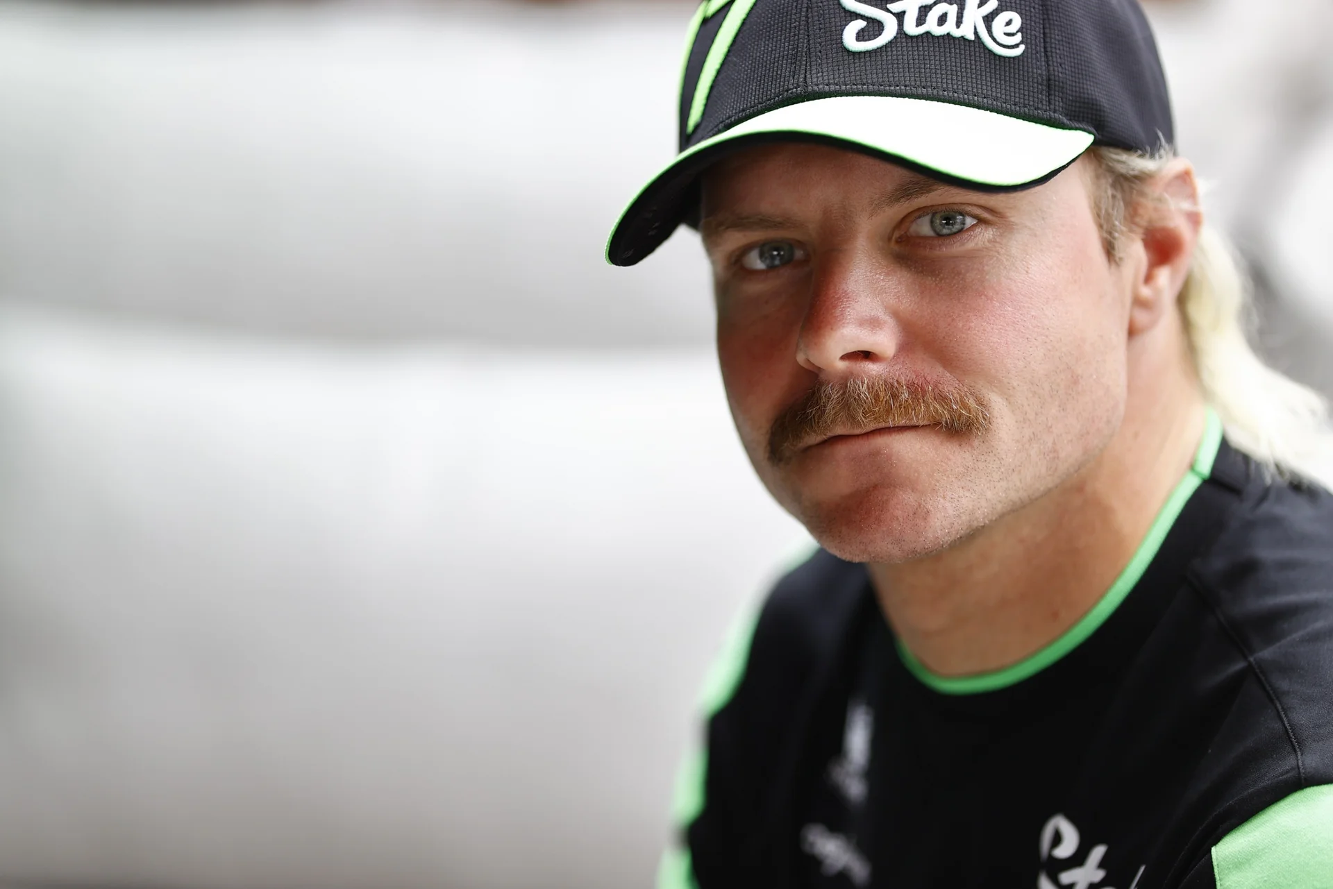 Close-up of Valtteri Bottas wearing Sauber F1 team gear, captured during a media event on November 6, 2024, ahead of the upcoming Formula 1 race weekend.
