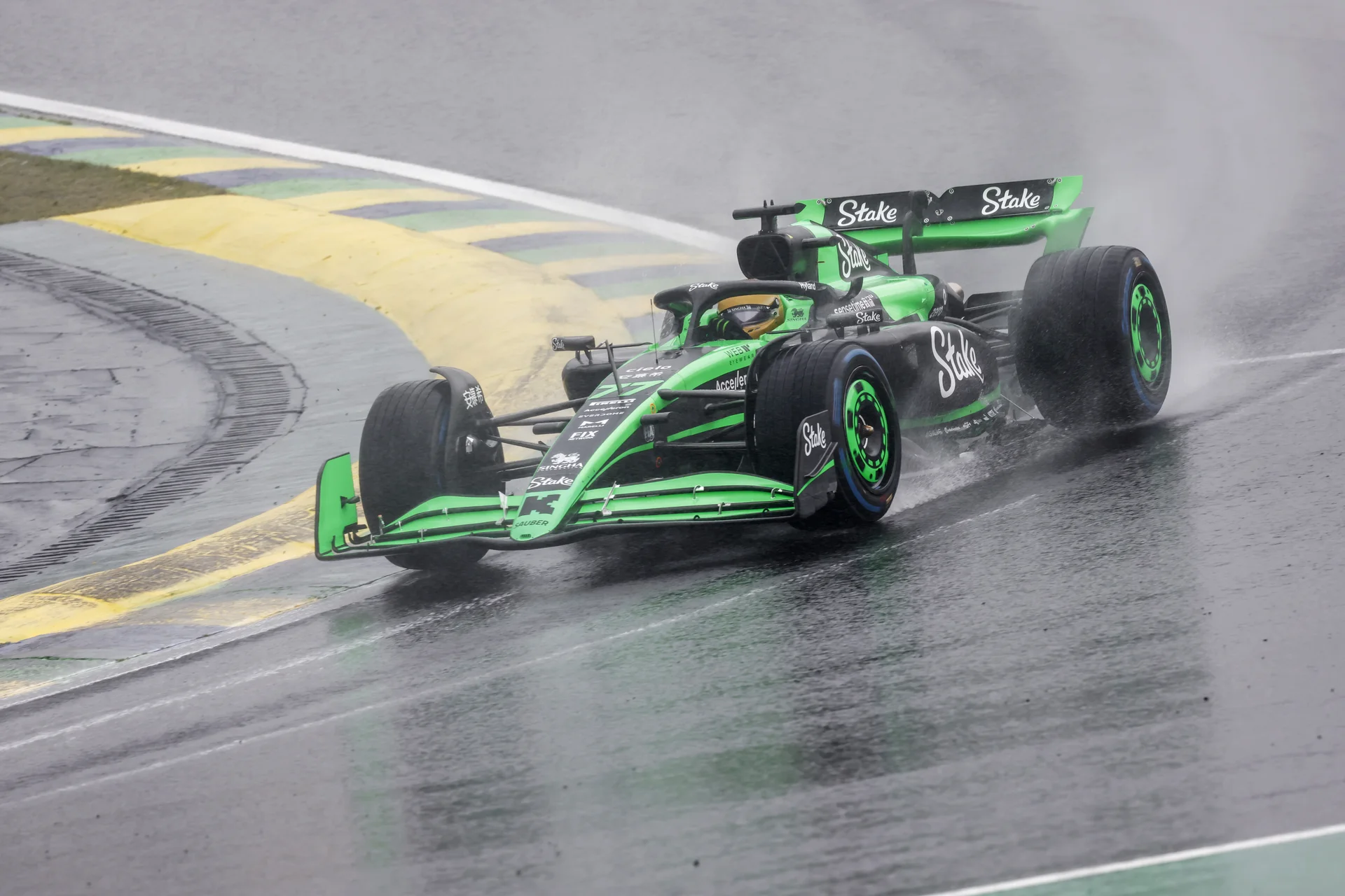 A Sauber Formula 1 car battling wet conditions on the Interlagos circuit during the 2024 São Paulo Grand Prix Sunday race, showcasing its performance in the rain.