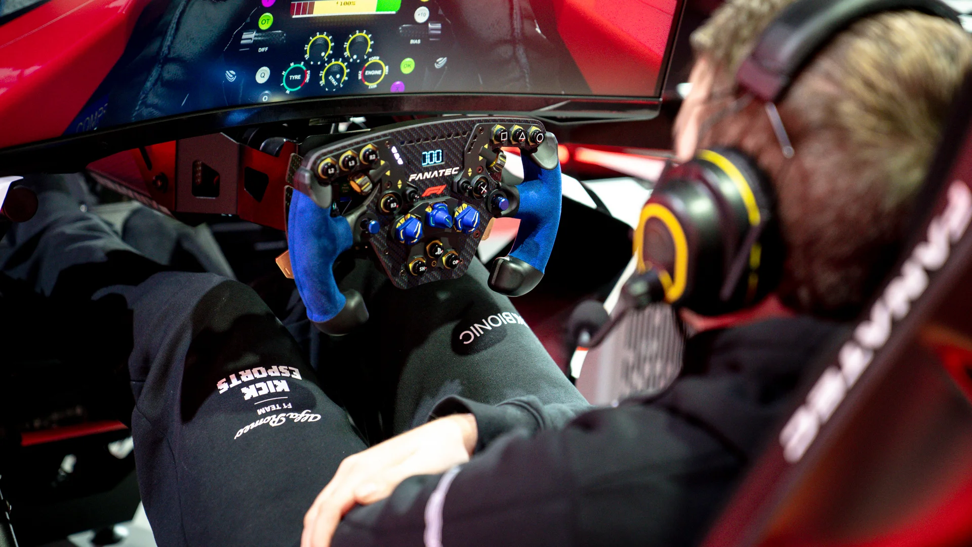 Professional F1 Esports driver in a high-tech racing simulator cockpit, focused on a virtual race.