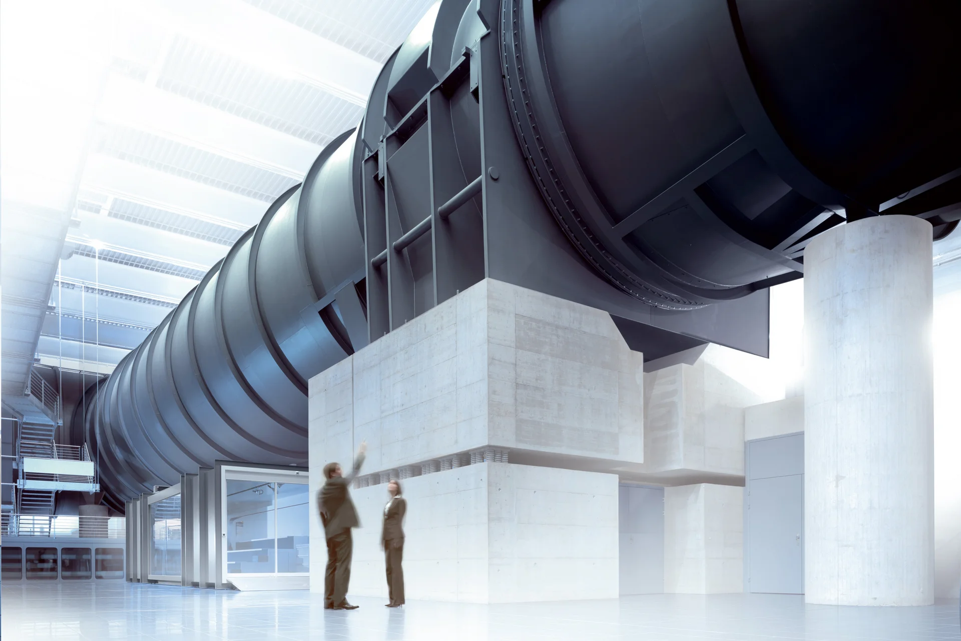 Inside of a wind tunnel, with large machinery and ventilation systems visible, showing a high-tech environment for testing.