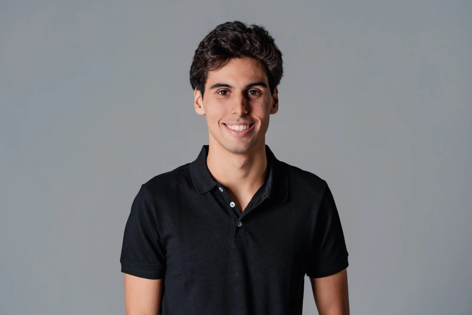 Portrait of Gabriel Bortoleto, Sauber F1 Academy driver, in team apparel, featured in a press release announcing his latest career updates.